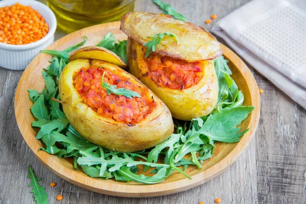 Whole potatoes with skins stuffed with vegetable tomato stew — Stock Photo, Image