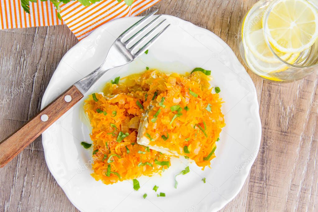 White fish fillet baked with carrots, onions, tasty dish of Russ