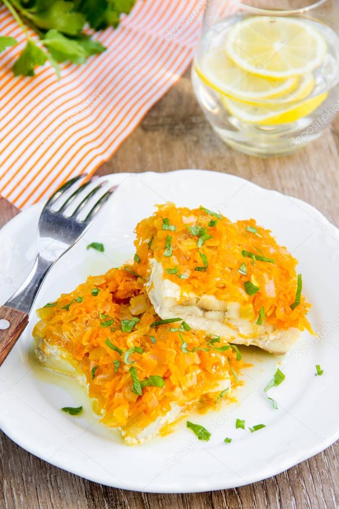 White fish fillet baked with carrots, onions, tasty dish of Russ