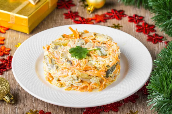 Christmas salad with carrots, mushrooms, pickled cucumbers, mayo — Stock Photo, Image