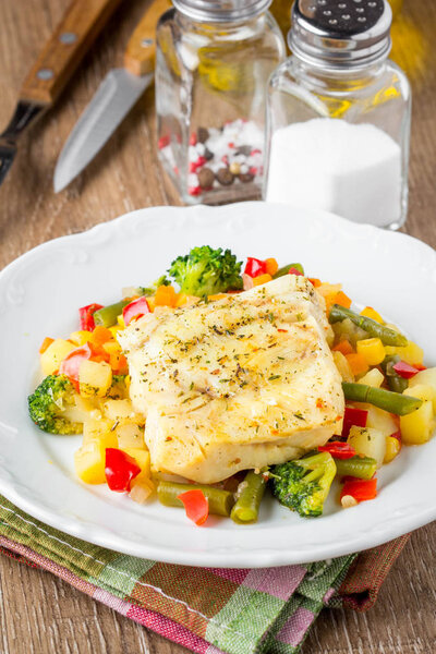 White fish fillet with vegetable stew, cod, sea bass, tilapia, p