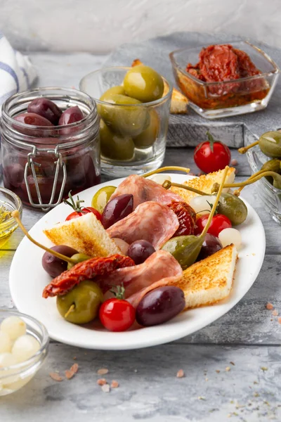Italian Antipasti Olives Capers Sun Dried Tomatoes Olive Oil Bread — Stock Photo, Image