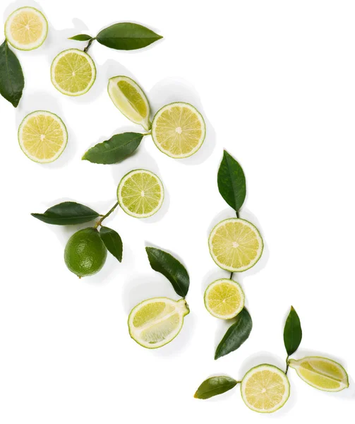 Lime fruits and green leaves. — Stock Photo, Image