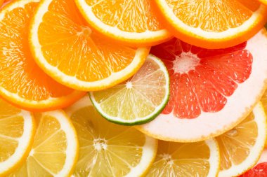 Narenciye meyve dilimleri ile doğal arka plan.