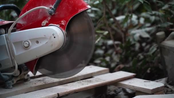 Concrete cutting stands on a wooden stand and works in a blank. 4k — Stock Video