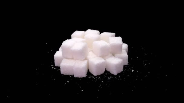 Refined sugar cubes close up rotate on a black background — Stock Video