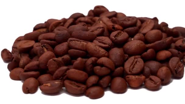 Close-up coffee beans rotate on a white background — Stock Video