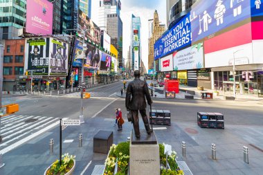 Manhattan, New York, USA - April 12, 2020:  No crowds in Times Square after self-quarantine and social distancing was put in place in New York City to slow the spread of the covid-19 pandemic. clipart