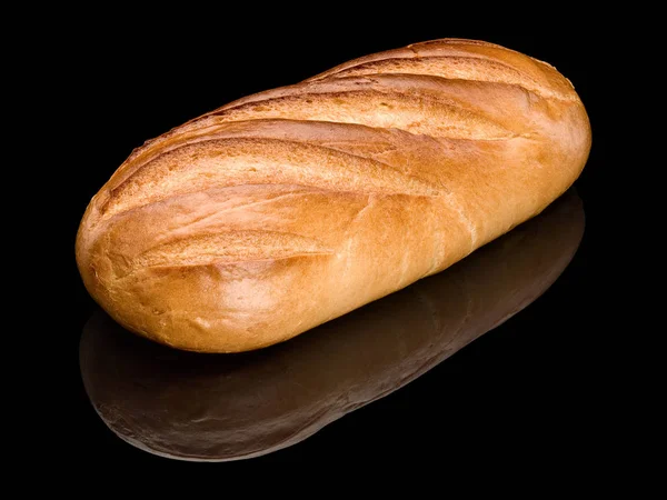 Long loaf of white, cut bread — Stock Photo, Image