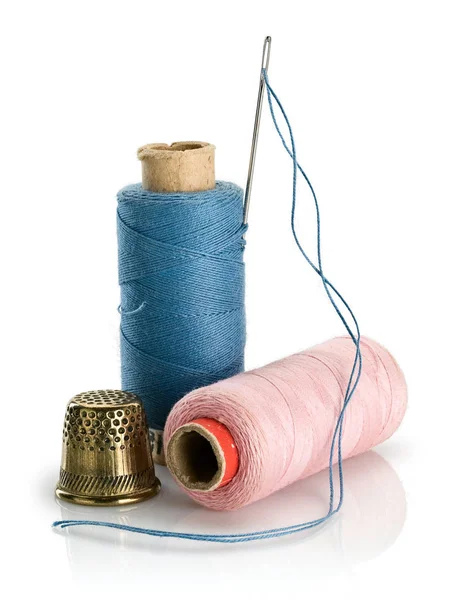 Sewing threads of blue and pink colors — Stock Photo, Image