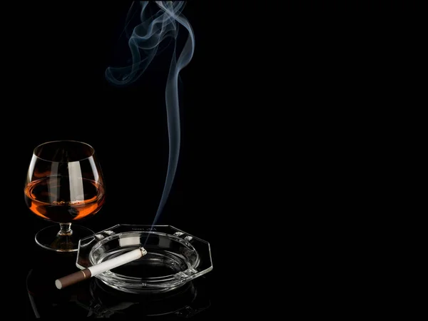 Smoke Burning Cigarette Ashtray Glass Cognac Isolated Black — Stock Photo, Image