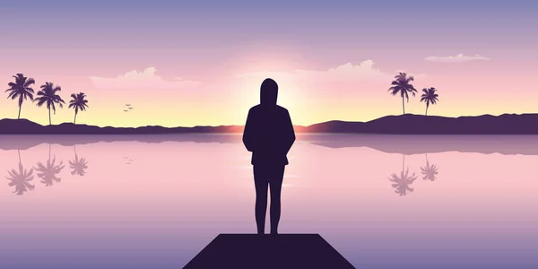 Одинокая девушка у океана на закате с видом на горы и пальмы — стоковый вектор