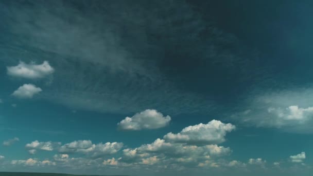 Dramatic drone motion from dark sky before rain to blue sky with white fluffy clouds. — Wideo stockowe
