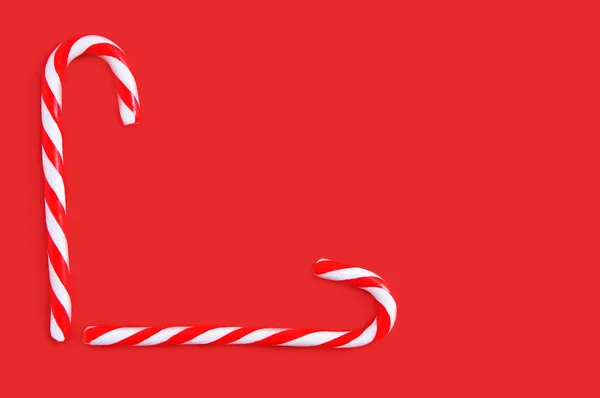 Two Christmas Candy Cane Red Background — Stock Photo, Image