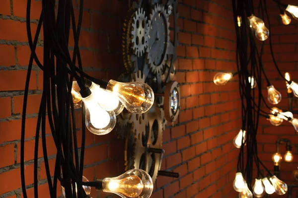 Incandescent Bulbs Background Orange Brick Wall Details Loft Interior — Stockfoto