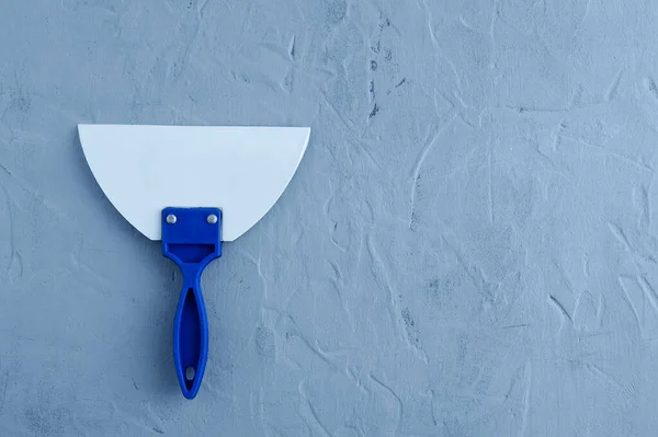 Jointing Rubber Spatula Blue Handle Gray Concrete Background View — Stock Photo, Image