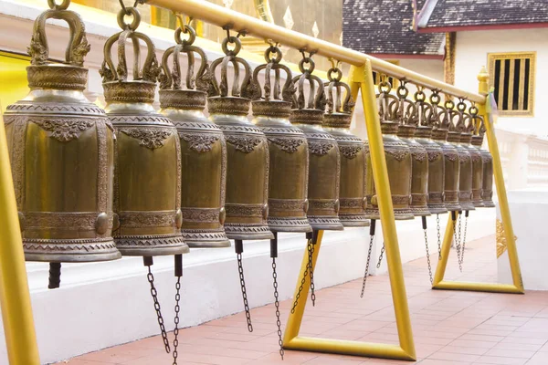 Row of Buddhist Prayer Bells outside Wat Phra Singh temple. Chiang Mai, Thailand. — ストック写真