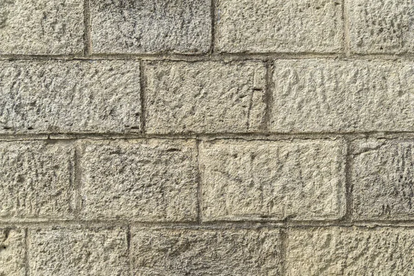Yellow crimean sawn limestone - traditional porous heat-insulating stone for walls, hedges and construction in Feodosia, Crimea. Natural material known since antiquity. Nature concept for design