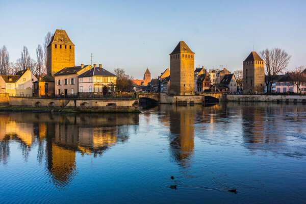 The medieval Covered Bridges of Strasbourg during the golden hour, France.