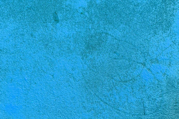 Smutsig sprucken betong bakgrund målad i blå färg — Stockfoto