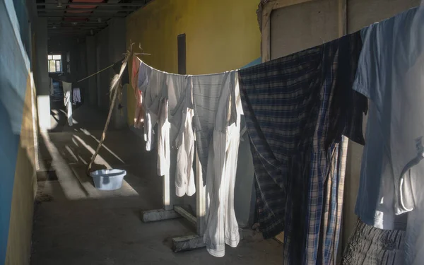 Drying washed clothes in the corridor.