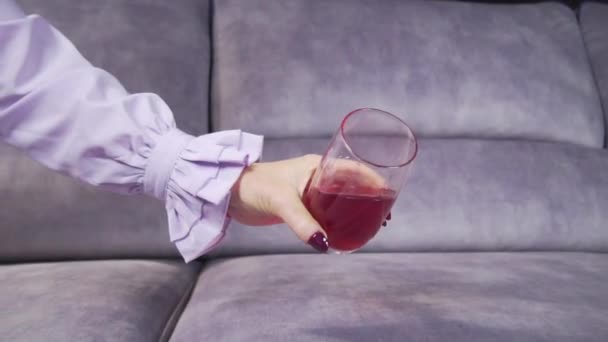 Juice is poured onto a sofa from a glass — Stock Video