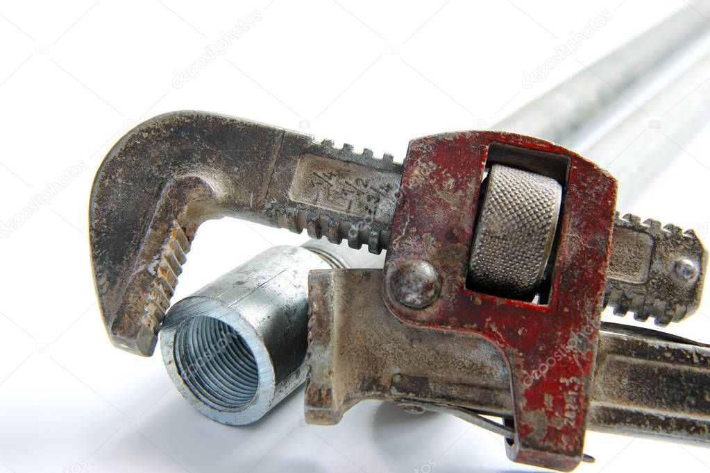 alligator wrench with water pipes on white background