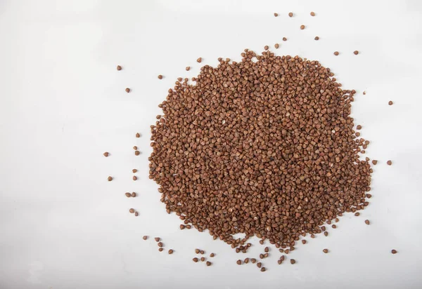 Buckwheat seeds closeup isolated on white background. Copy spaes. — Stock Photo, Image