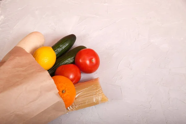 Food Tomatoes Cucumbers Daikon Pasta Lemon Orange Paper Bag Lie — Stock Photo, Image