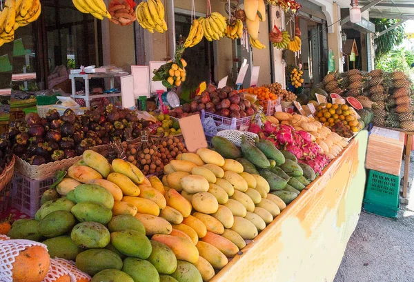 Mango fruits, dragon, mangostite, pineapples, bananas at the bazaar in Thailand. Asia. Travel. Vegetarian food