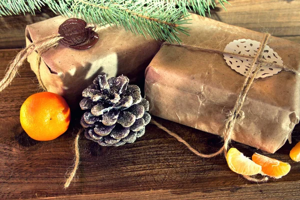 Christmas gifts packed in kraft paper — Stock Photo, Image