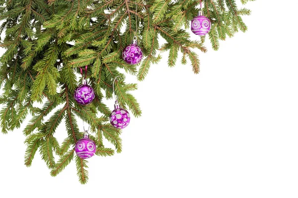 Fir branch with glass balls on white — Stock Photo, Image