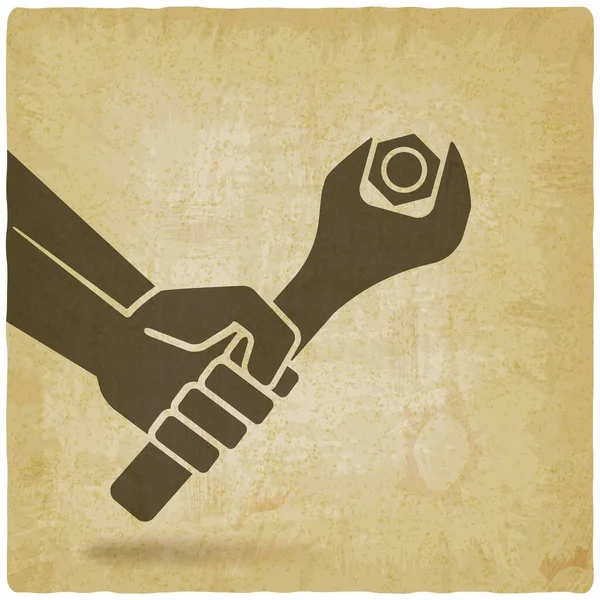 Hand with spanner tightening nut on vintage background — Stock Vector