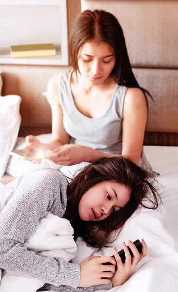 Selective Focus Woman Laying Bed Front Blurred Sitting Lady — Stock Photo, Image