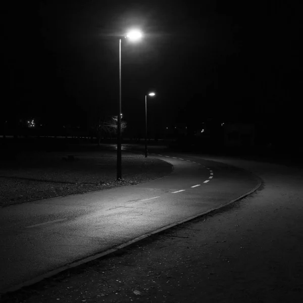 Black and white film grain running at night. Concept of danger and mystery — Stock Photo, Image