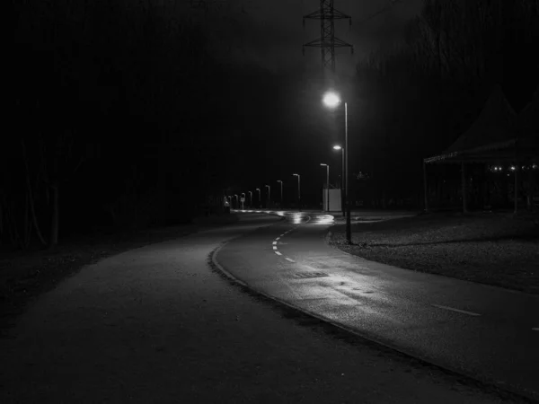 Black and white film grain running at night. Concept of danger and mystery — Stock Photo, Image