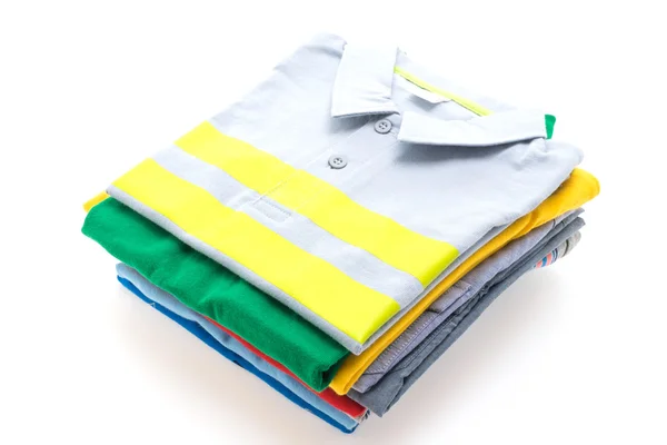 Pilha de camisetas e camisas pólo — Fotografia de Stock