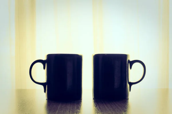 Latte coffee in black cups — Stock Photo, Image