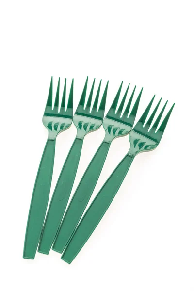 Зеленые пластиковые вилки — стоковое фото