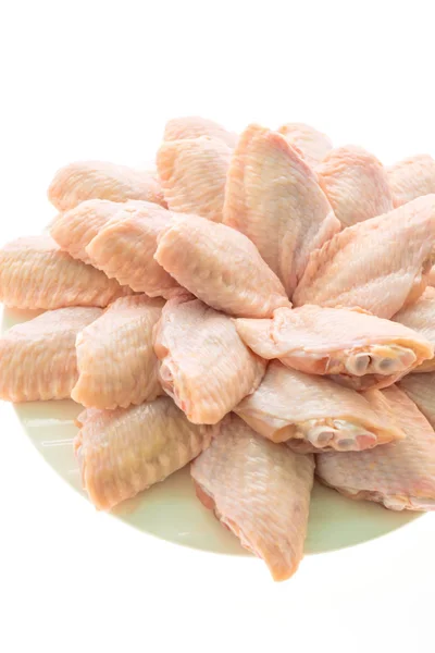 Raw chicken meat and wing in white plate — Stock Photo, Image