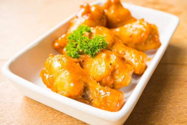 Grilled buffalo wings in white plate — Stock Photo, Image