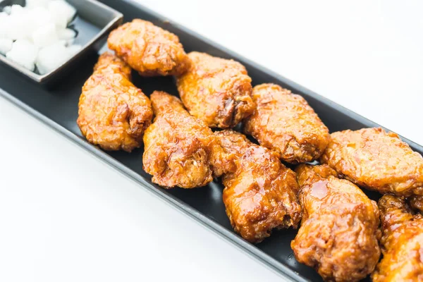 Fried chicken in black plate — Stock Photo, Image