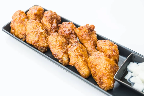 Fried chicken in black plate — Stock Photo, Image