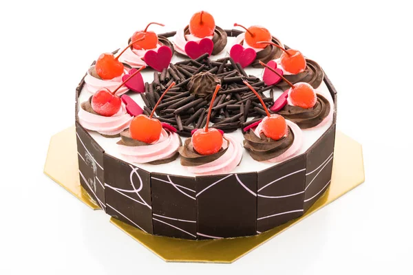 Üzerinde kiraz olan çikolatalı pasta.