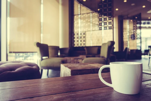 White cofffee cup on wooden table — Stock Photo, Image