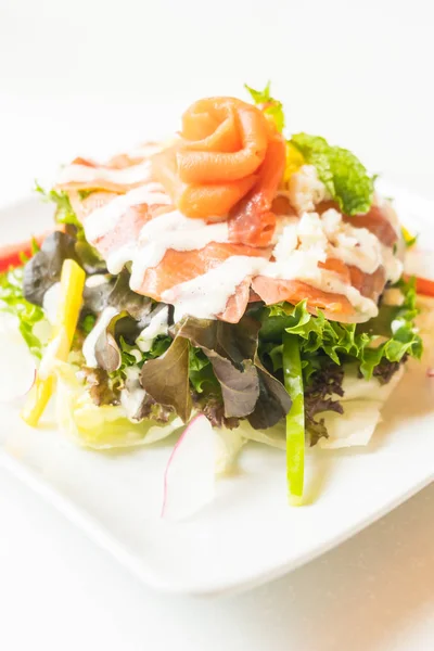 Salmon salad in white plate — Stock Photo, Image