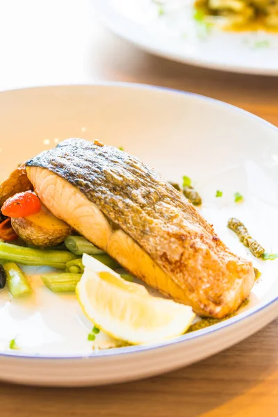 Salmon steak in plate — Stock Photo, Image