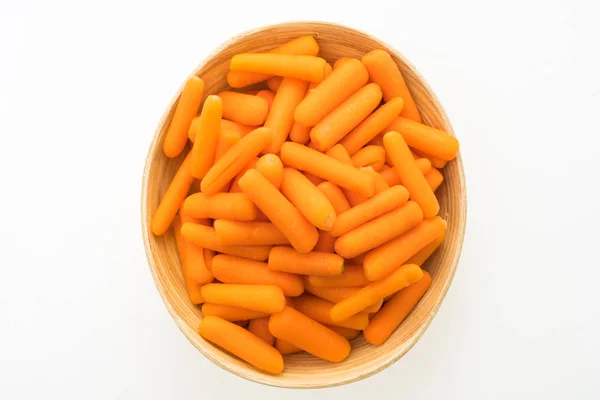 Baby carrot in wooden bowl — Stock Photo, Image