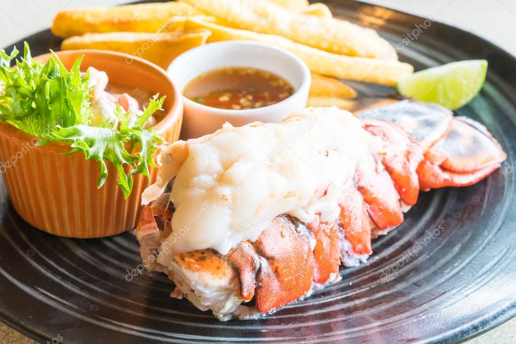 Lobster steak in black plate