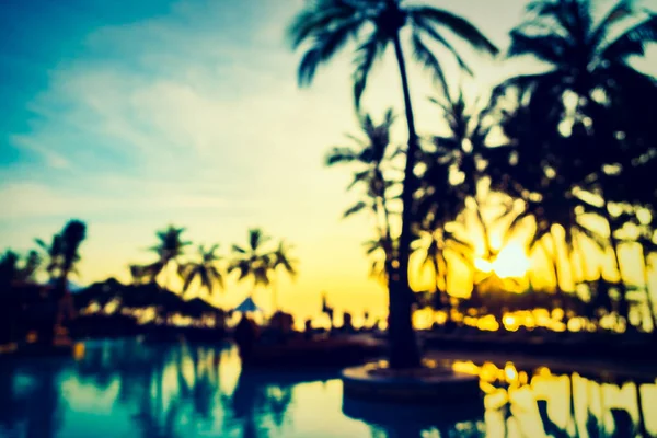 Silhouette coconut palm tree around swimming pool — Stock Photo, Image